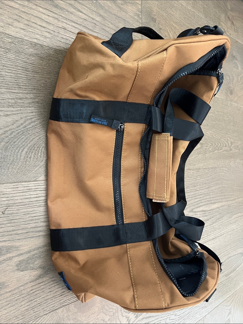 True Religion Tan Canvas Duffel with Black Straps